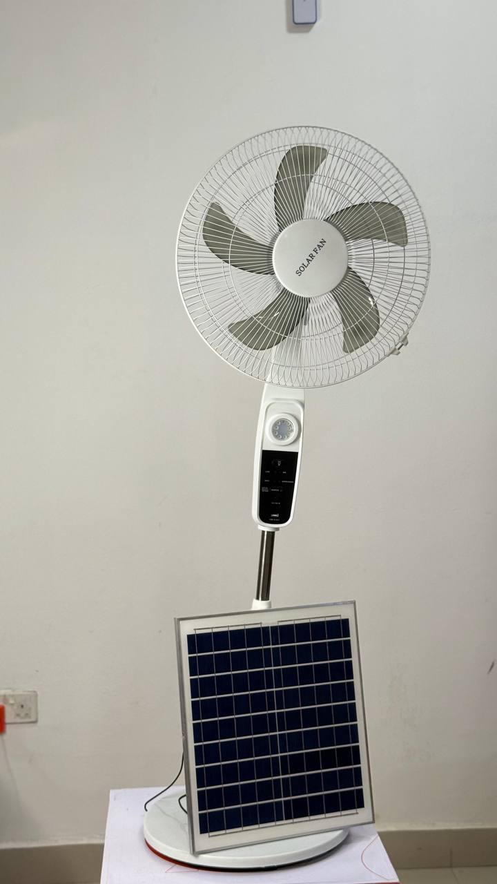 Solar fan with solar panel set up at home